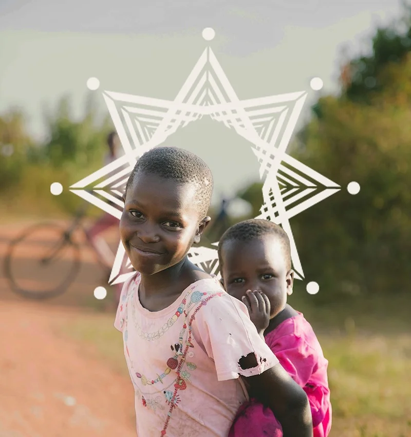 Two children standing together outdoors